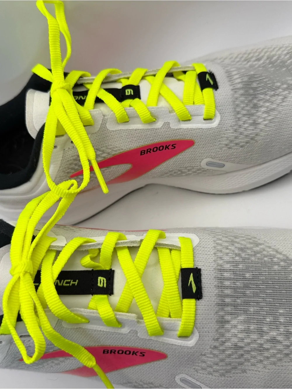 Brooks White Running Shoes with Neon Yellow Laces and Pink Accents
